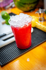 Preparation of cocktail. Adding ice, shaking ingredients and decorating with mint