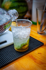 Prepare of fresh mojito cocktail with ice