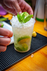 Prepare of fresh mojito cocktail with ice