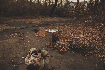 The boy was horrified by an unidentified flying object. Mystical item causing a mental disorder. man is standing in front of an alien object. shiny metal cube
