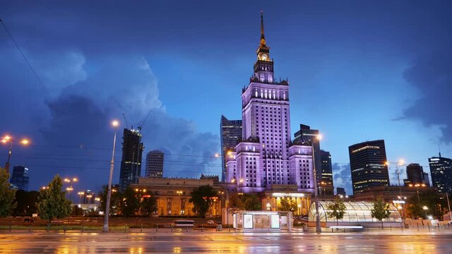 Evening time lapse of Warsaw city downtown in Poland with incoming storm, street traffic and skyline with Palace of Culture and Science.