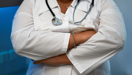 the girl in the medical gloves and lab coat crossed her arms over her chest