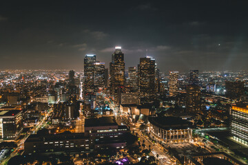 Naklejka na ściany i meble Aerial View of Downtown Los Angeles Skyline with City Lights from Aerial Perspective