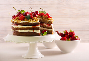 Layered cake with berries on top