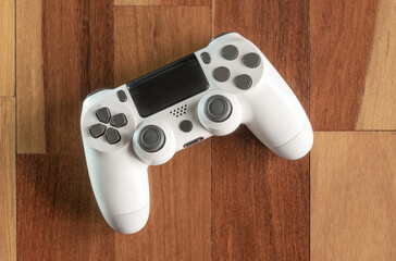 Game controller on wooden floor © miglagoa