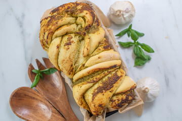 Slices of Italian pesto braided bread 