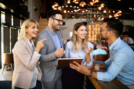 Business colleagues having conversation during coffee break