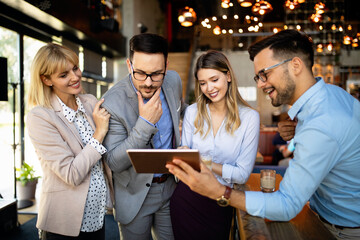 Business people having fun and chatting at workplace office