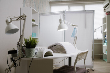 Beauty salon interior, no people. Manicure workplaces with professional tools