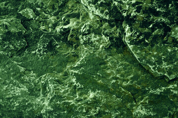 ancient dark green moss granite stone surface of cave for interior