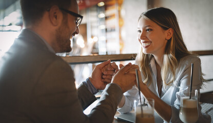 Happy romantic smiling people having date in restaurant. Couple in love.