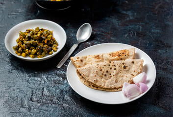 roti and bhindi fry, famous indian meal flatbread and okra fry