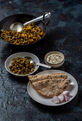 roti and bhindi fry, famous indian meal flatbread and okra fry