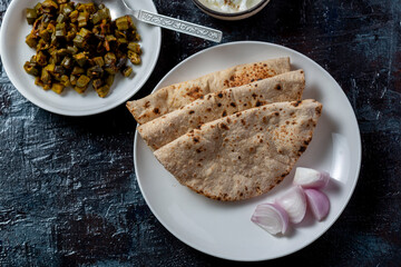 roti and bhindi fry, famous indian meal flatbread and okra fry