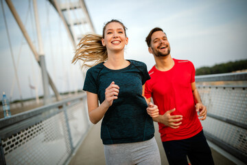 Sport couple. Young man and woman jogging outdoor