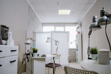Beauty salon interior, no people. Manicure workplaces with professional tools