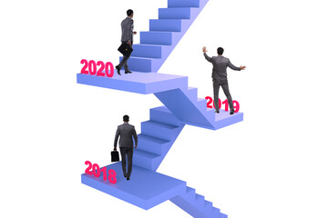 Businessman climbing stairs on yearly basis