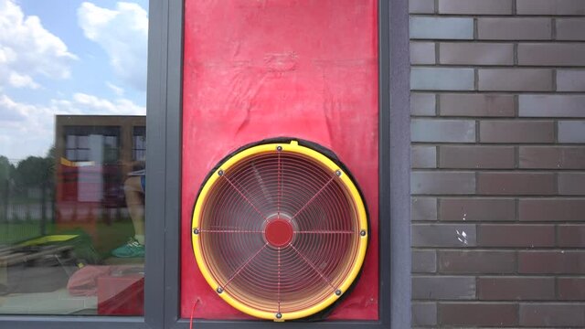 Door blower test equipment mounted on townhouse door. Gimbal movement