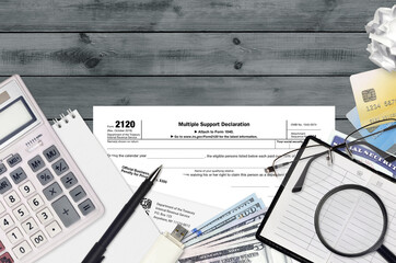IRS form 2120 Multiple support declaration lies on flat lay office table and ready to fill. U.S....