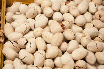 Closeup of raw pecan (Carya illinoinensis) nut background, selling at Bazaar in Bishkek, Kyrgyzstan