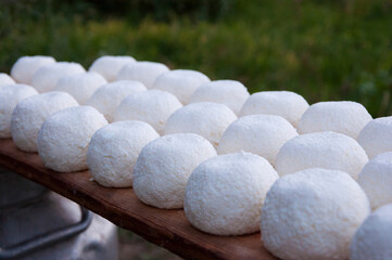 Assortment of Kashk, Qurut, Chortan, Qurt, Aaruul at the market, a type of hard cheese in Central...
