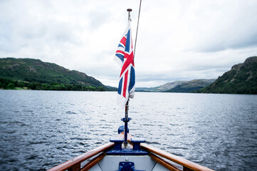 Fototapeta premium boat on the lake. With Union Jack flag