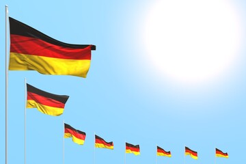 beautiful many Germany flags placed diagonal on blue sky with space for content - any holiday flag 3d illustration..