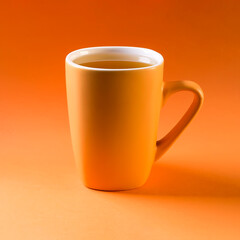 Cup ceramic of hot tea on a orange background