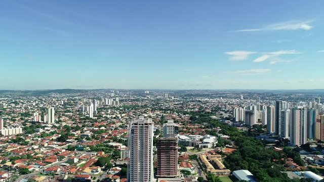 Aerial view of the city of Goi&acirc;nia, state of Goi&aacute;s, Brazil. City divided between an area full of buildings and others of residential houses. Concept of population growth increasing.