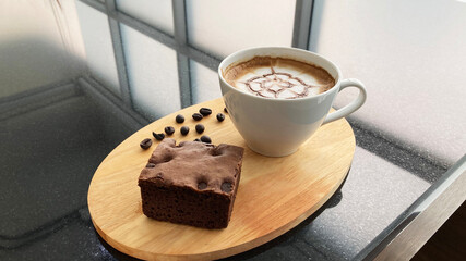 Closeup of coffee cup and brownies on a table