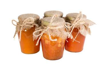 Glass jars with red and yellow jam, the lid on top is tied with a rough cloth and hemp rope. Isolate on white background.