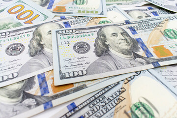 Dolar.  american dollars in one hundred banknotes. 100 new us dollar banknotes as background