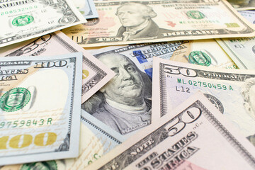 Dolar.  american dollars in one hundred banknotes. 100 new us dollar banknotes as background