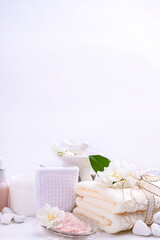 Various spa and beauty threatment products isolated on white background. Skin cream, tonicum bottle, dry flowers, leaves, rose and Himalayan salt. Organic cosmetics, spa concept. Empty. Copy space