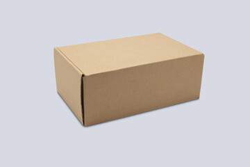 Mockup closed brown packaging paper box isolated on white background.
