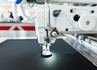 Fabric industry production line. Textile factory. Working tailoring process
