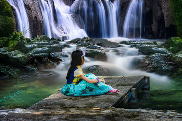 woman in a waterfall