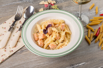 pasta with red fish in a creamy sauce