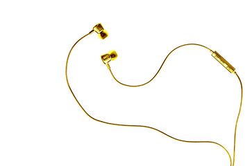 Golden wired earphones isolated on white background