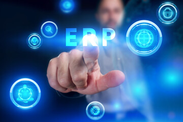 Business, Technology, Internet and network concept. Young businessman working on a virtual screen of the future and sees the inscription: ERP