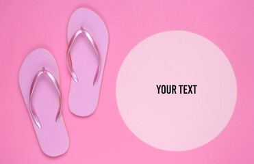 Pink flip flops on yellow background with pink pastel circle for copy space. Minimalistic vacation on the beach concept. Summer time. Copy space