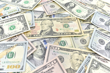 Dolar.  scattered various american banknotes. US dollars banknote
