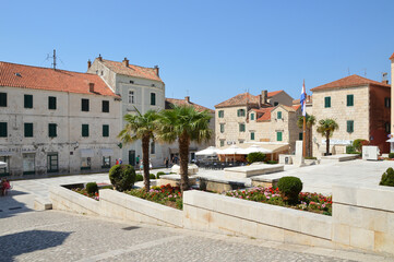 Fototapeta na wymiar A square in the Croatian town of Makarska on a summer day.