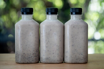 Mix of various nuts smoothie in plastic bottle