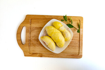 Fresh durian fruit placed on a white plate. Durian the king of fruits in Thailand
