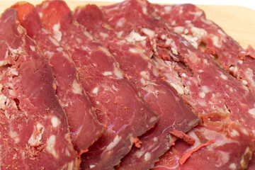 Turkish bacon on white background. thinly sliced ​​bacon. Turkey meat special to the city of Kayseri.
