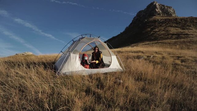 People inside the tent. on a mountainside in Montenegro mooving camera
