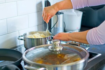 shot of woman arms cooking in a kitchen