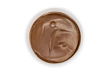 Hazelnut cream with cocoa on white background. hazelnut cream in bucket on whitebackground