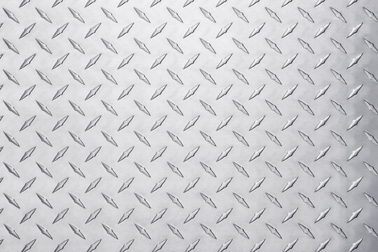 metallic steel plate with diamond pattern. light silver metal background